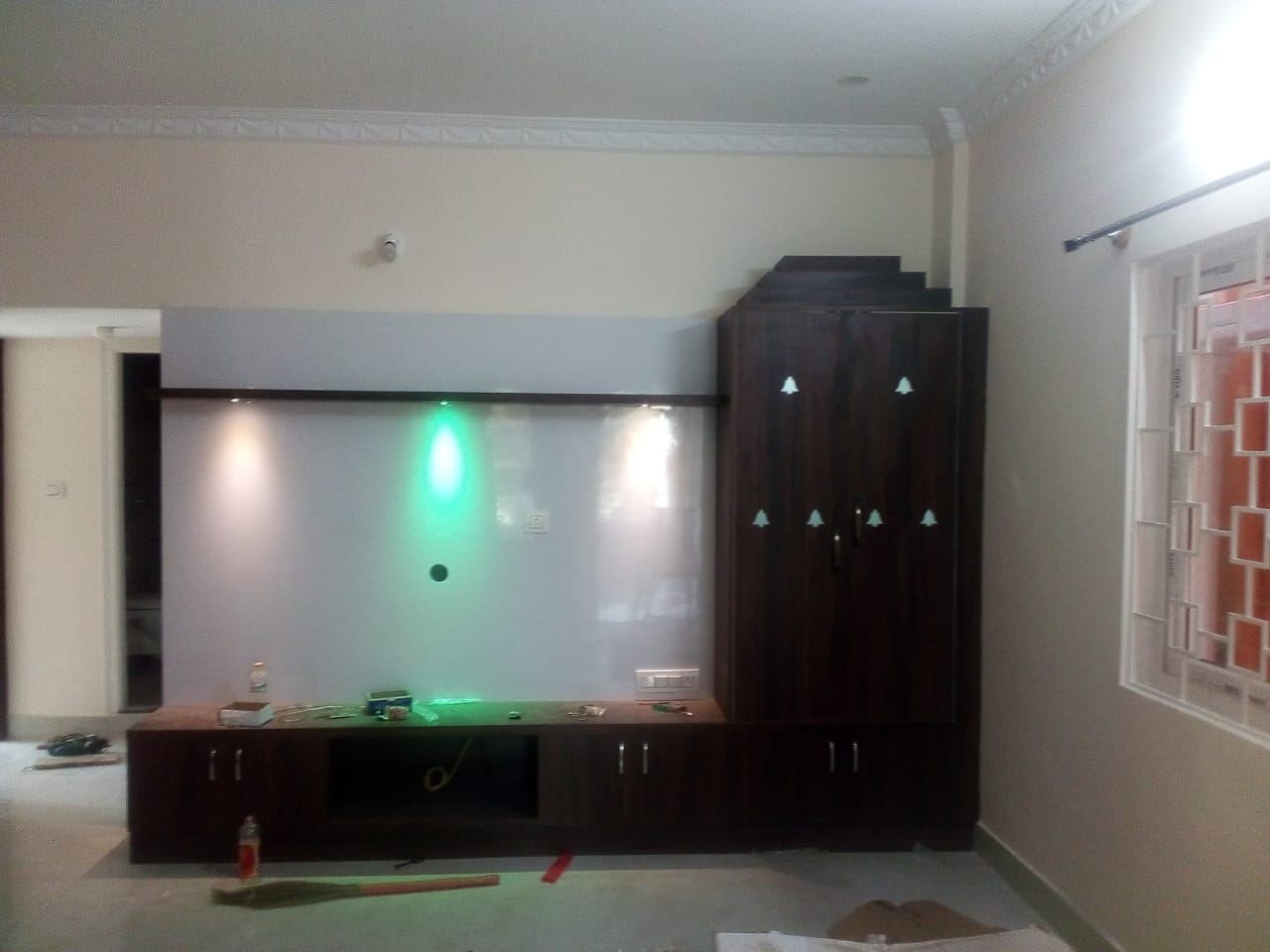 The same media wall with cove and spot lighting switched on
